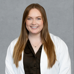 Madison Kowalski, healthcare provider at Optima Medical in Queen Creek, Arizona, smiling in a professional headshot.