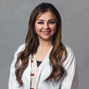 Mariyah Bejarano, medical provider at Optima Medical in Safford, Arizona, smiling and wearing a white coat in professional headshot.