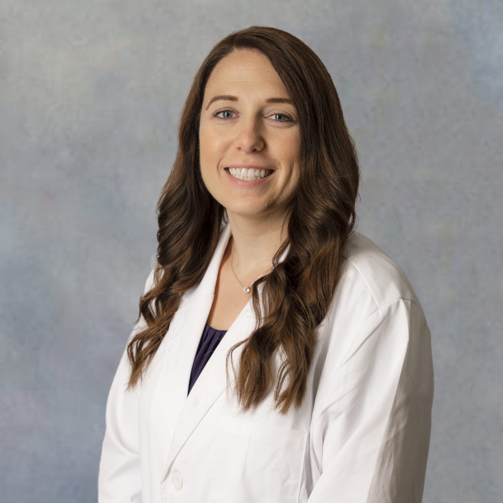 Raven Taylor, primary care provider at Optima Medical in Queen Creek, Arizona, wearing a white coat and smiling.
