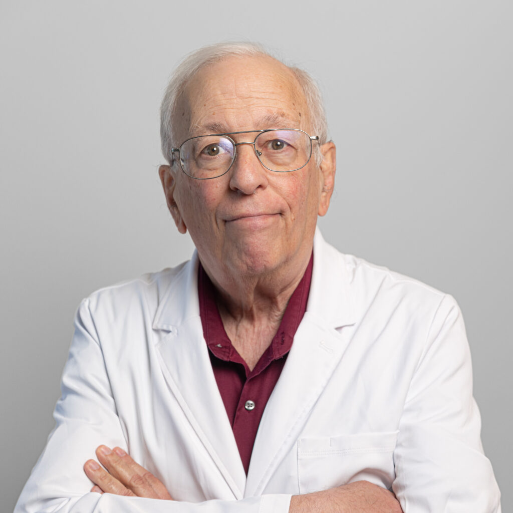 Dr. Lawrence Rothenberg, primary care physician at Optima Medical in South Bullhead City, Arizona, wearing glasses and a white coat.
