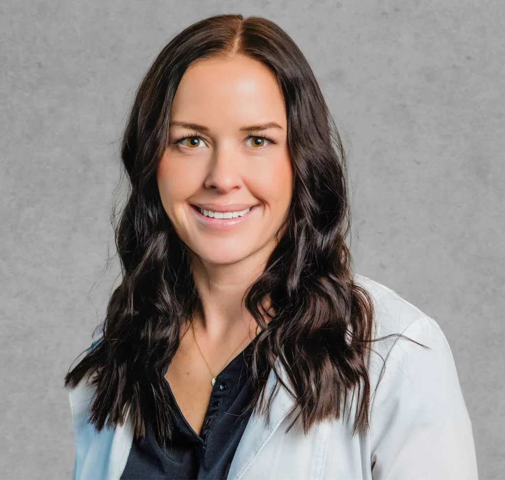 Jami Potter, primary care provider at Optima Medical in Prescott Valley, Arizona, wearing a white medical coat and smiling.